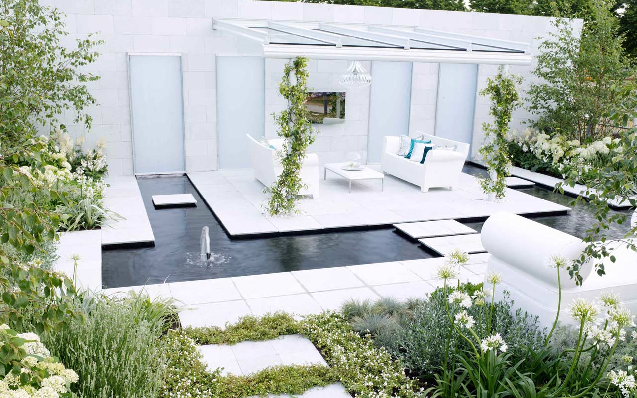 Award winning garden with sofas and water feature